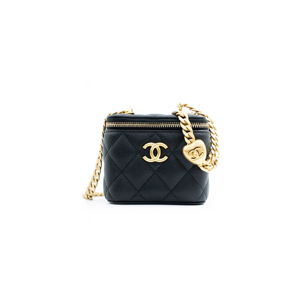 Chanel small gold ball makeup bag